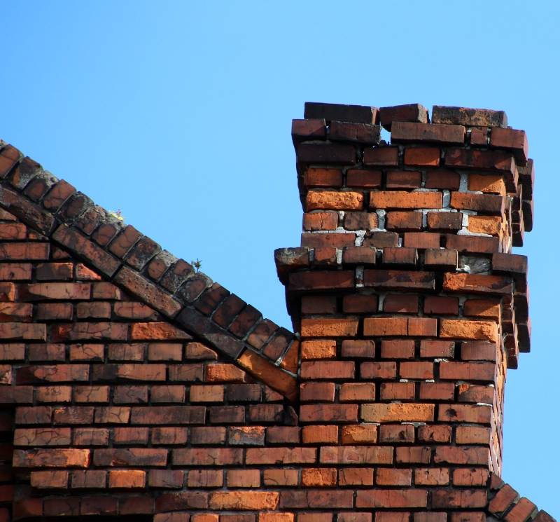Signs Your Needham Home Needs a Chimney Inspection Damaged chimney on an Needham home showing cracks and missing mortar